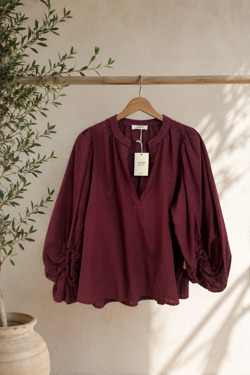 BLUSA ABULLONADA BERENGENA